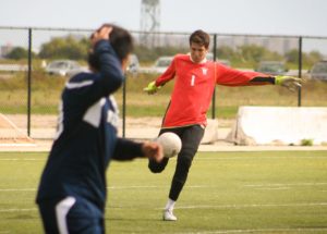 Ollie Garrett kicking a soccer ball