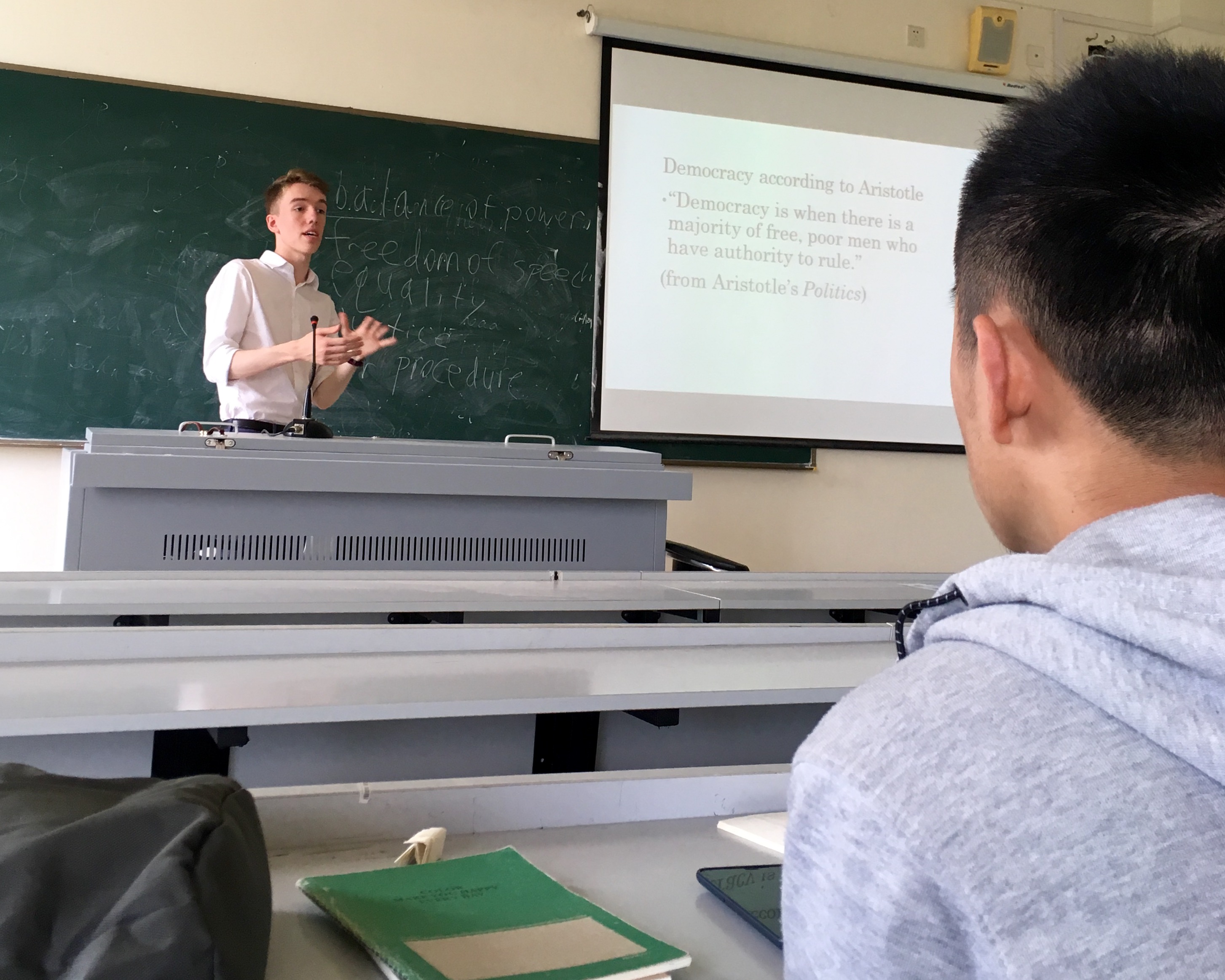 Male TKC Student giving a presentation in China