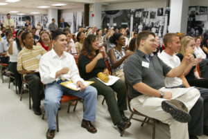 A group of people listening to a lecture