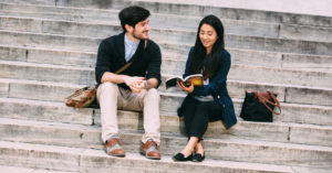 Humanities major students on a building's steps