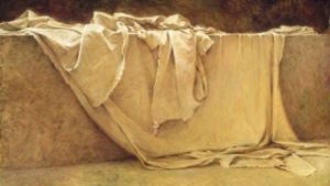 An empty burial shroud in a tomb