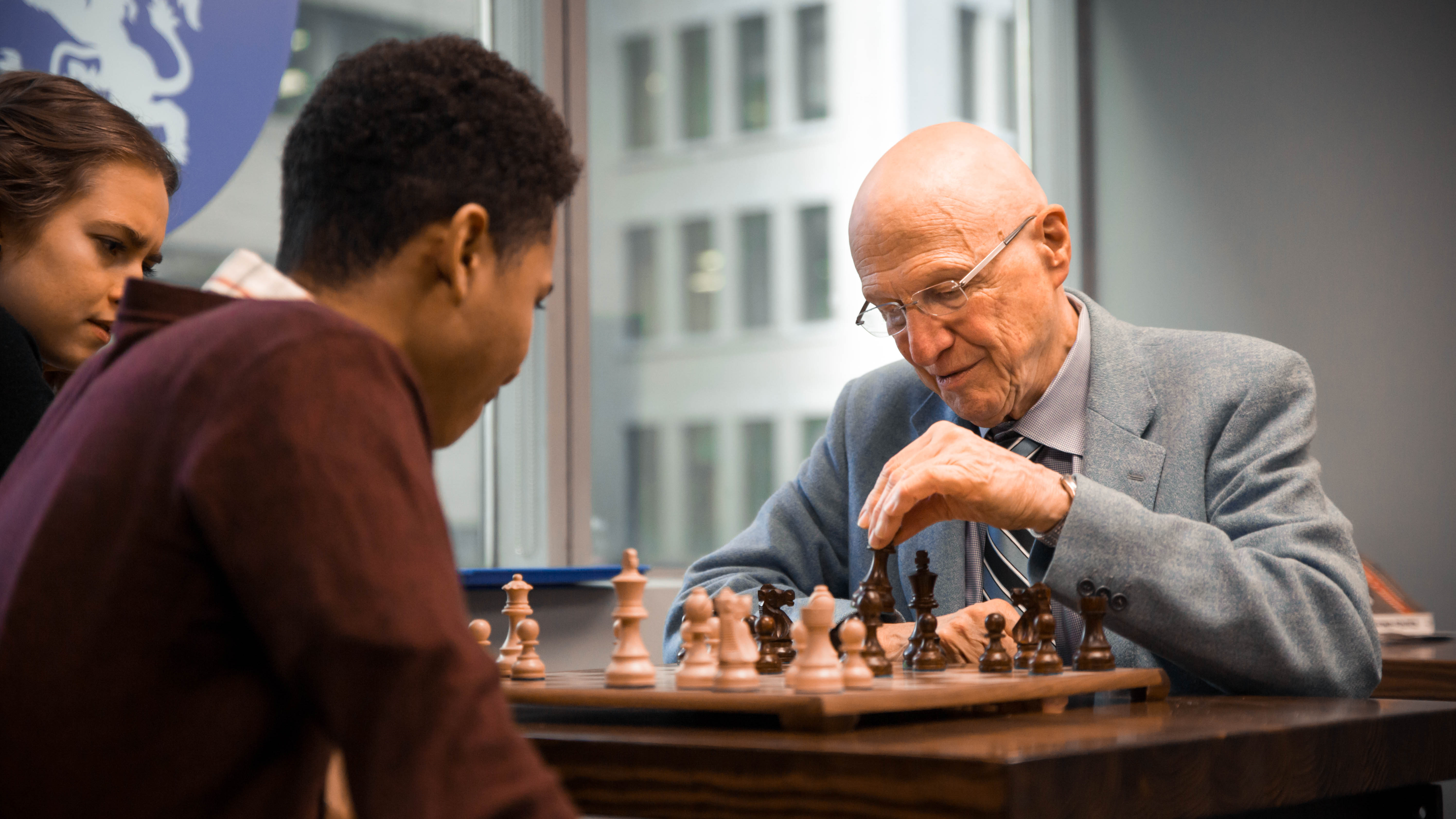 Dr. Kreeft playing chess with students