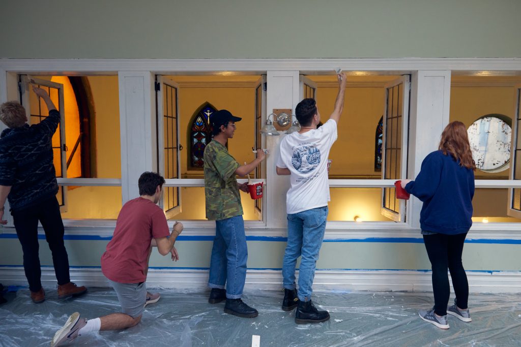 Students paint church